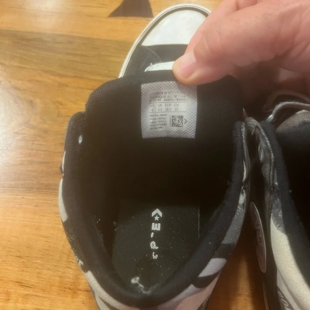 Converse Black and White High-Top Sneakers with Iconic Design
